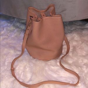 Cross body bucket tote